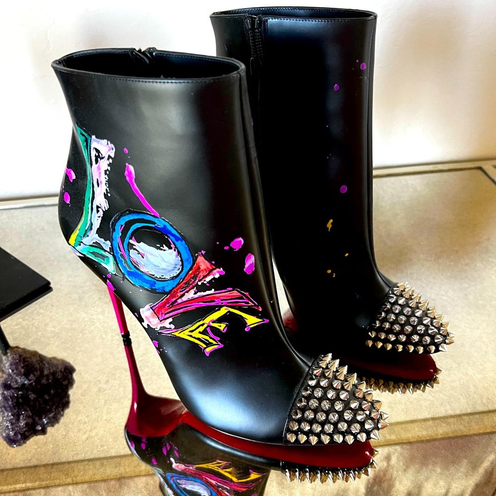 CHRISTIAN LOUBOUTIN
Love Is A Boot Red Sole Booties In Black